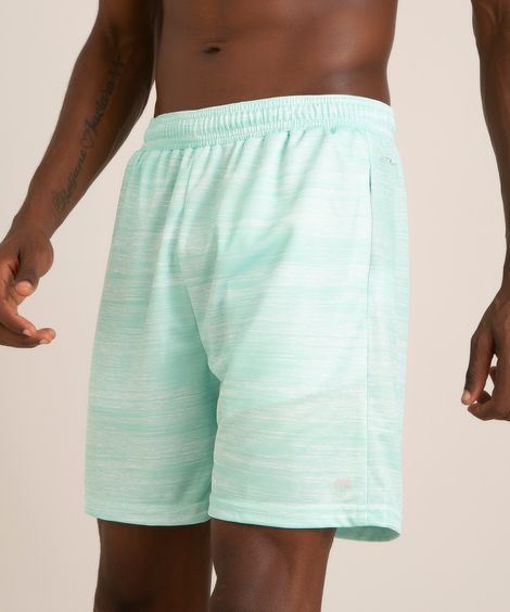 short esportivo com bolsos e refletivos verde claro