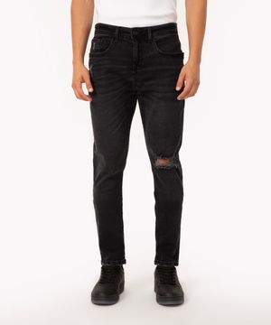 calça jeans carrot rasgada com bolsos preta