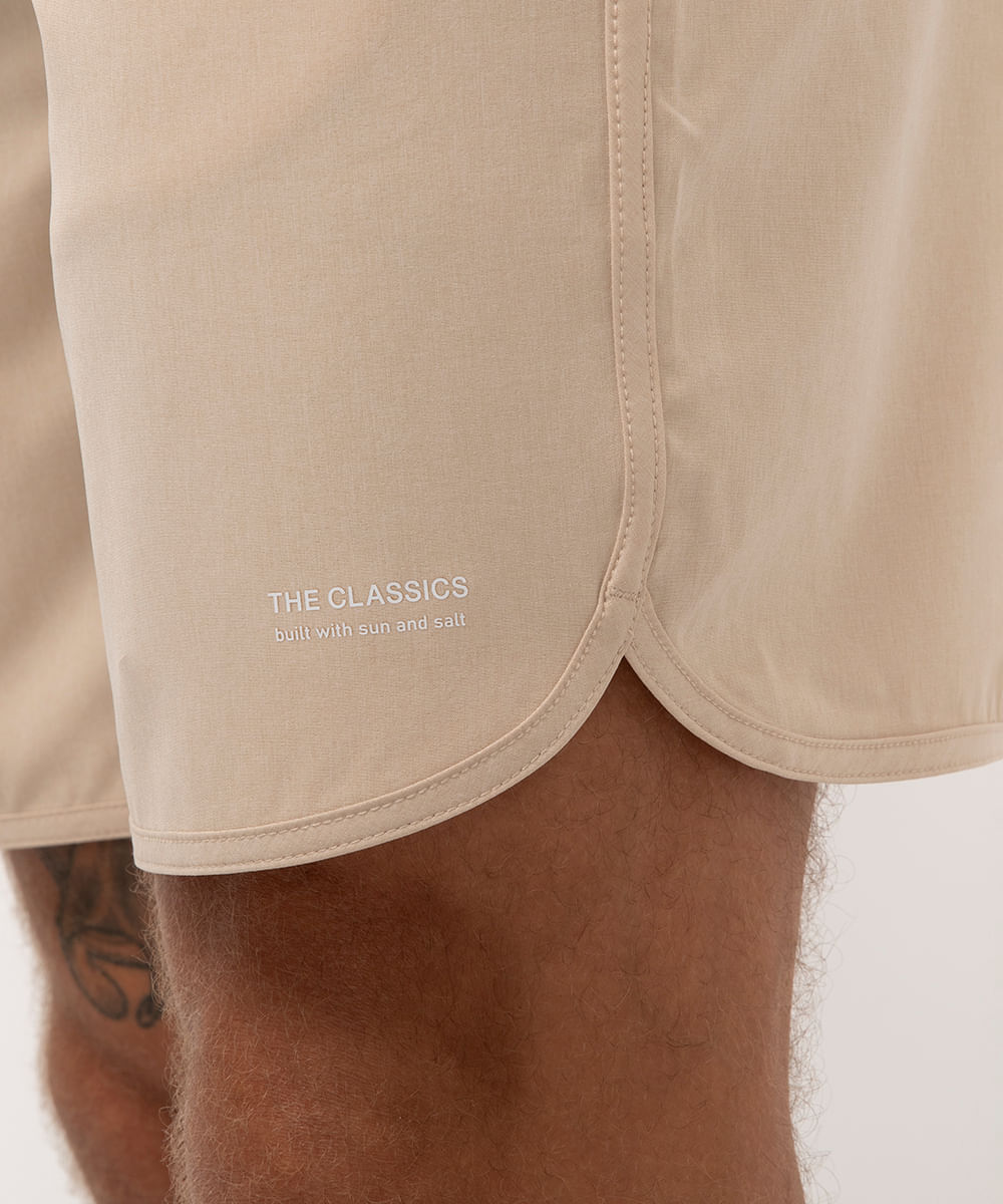 short praia com bolsos bege