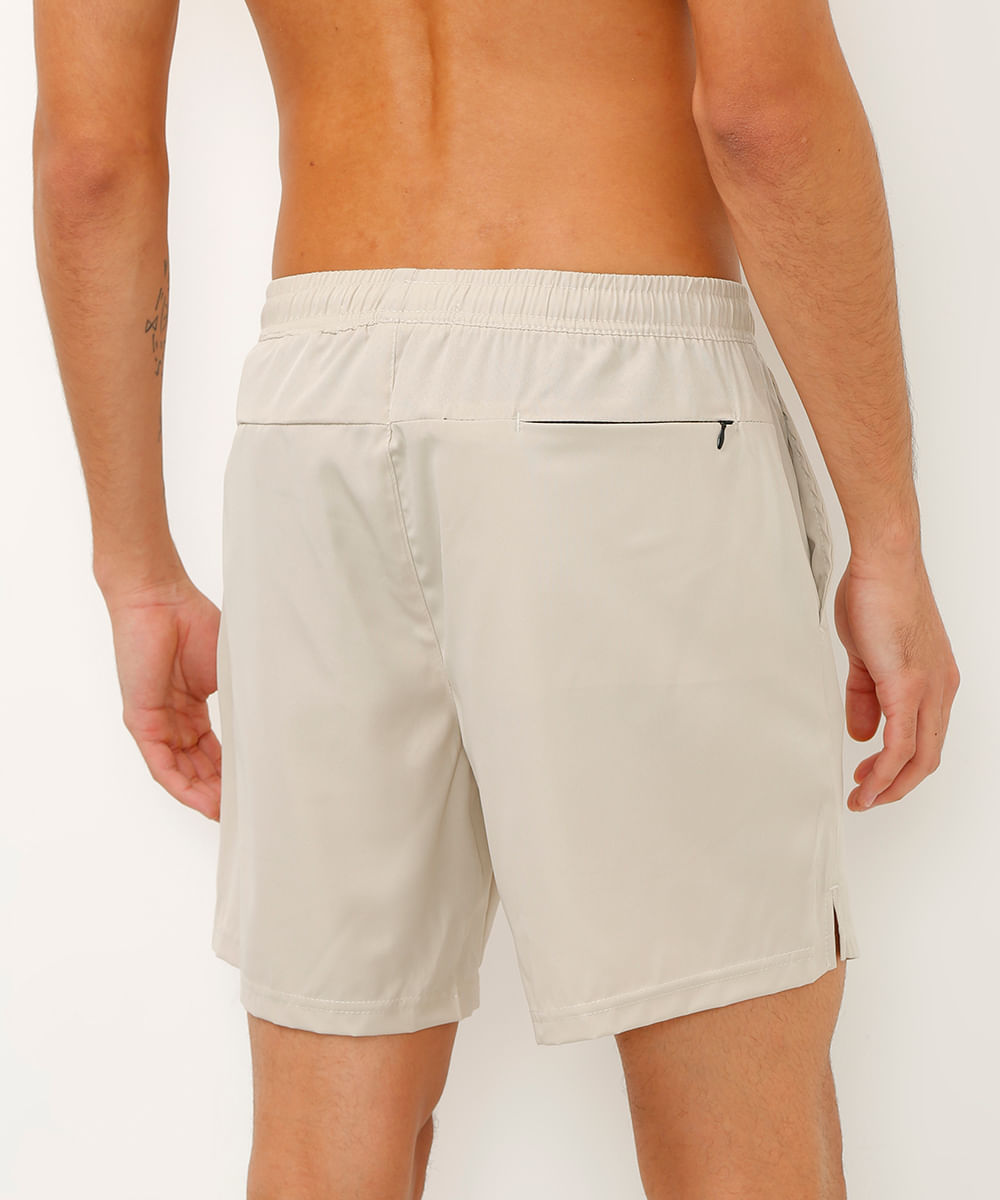 short reto com bolsos esportivo bege