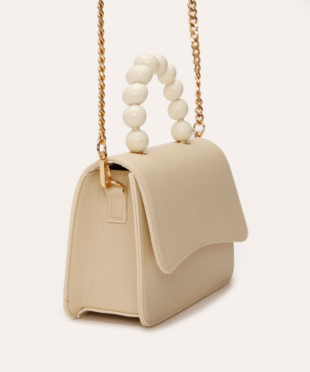bolsa crossbody com corrente e bolinhas off white