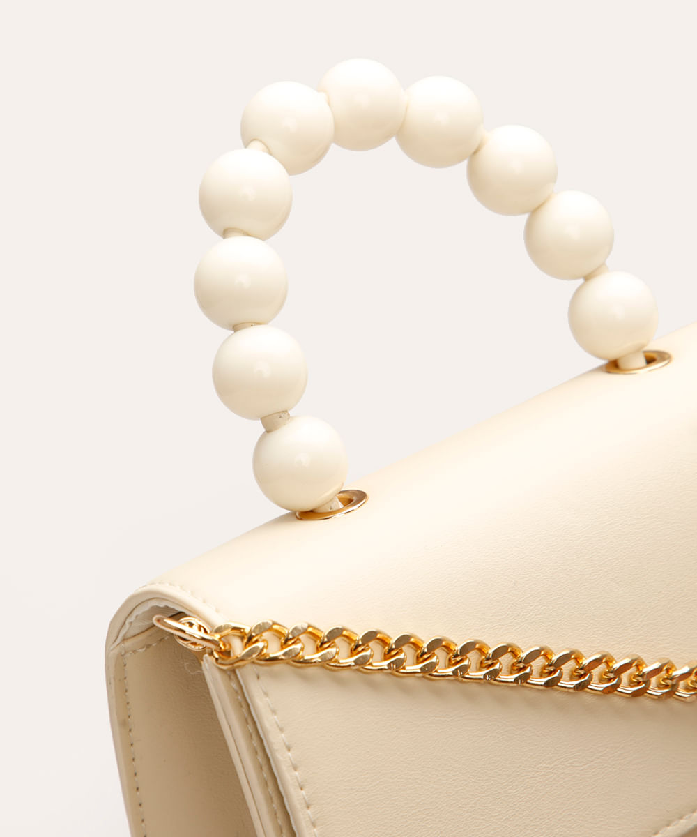 bolsa crossbody com corrente e bolinhas off white