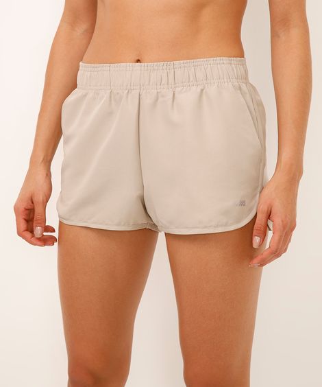 short running feminino com bolso esportivo bege