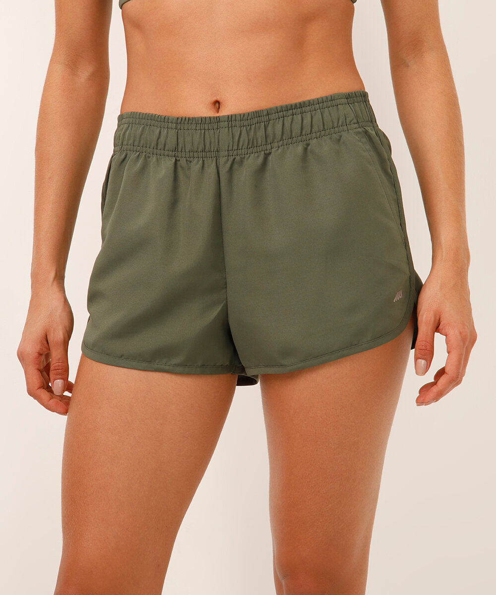 short running feminino com bolso esportivo verde