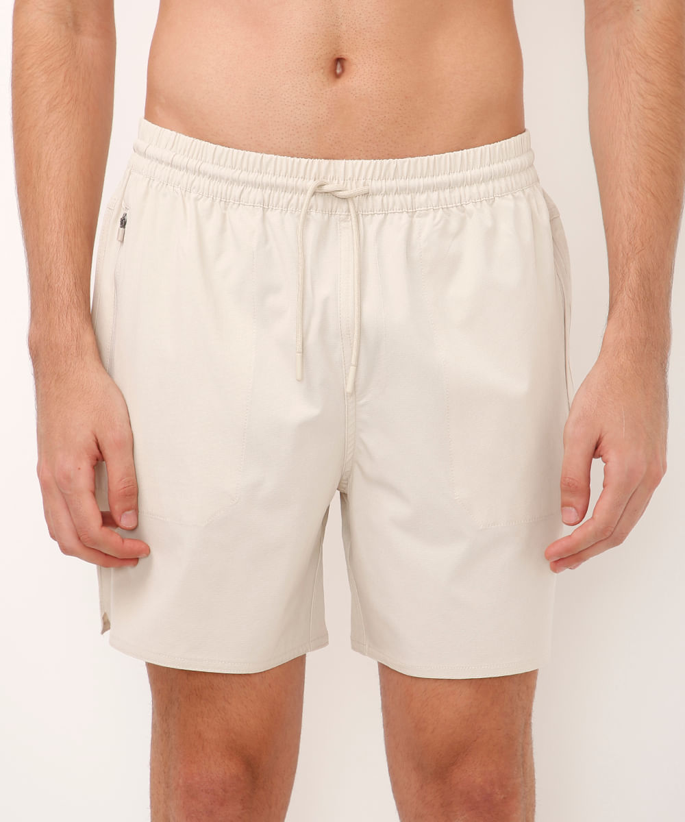 short cós elástico bolso com zíper bege