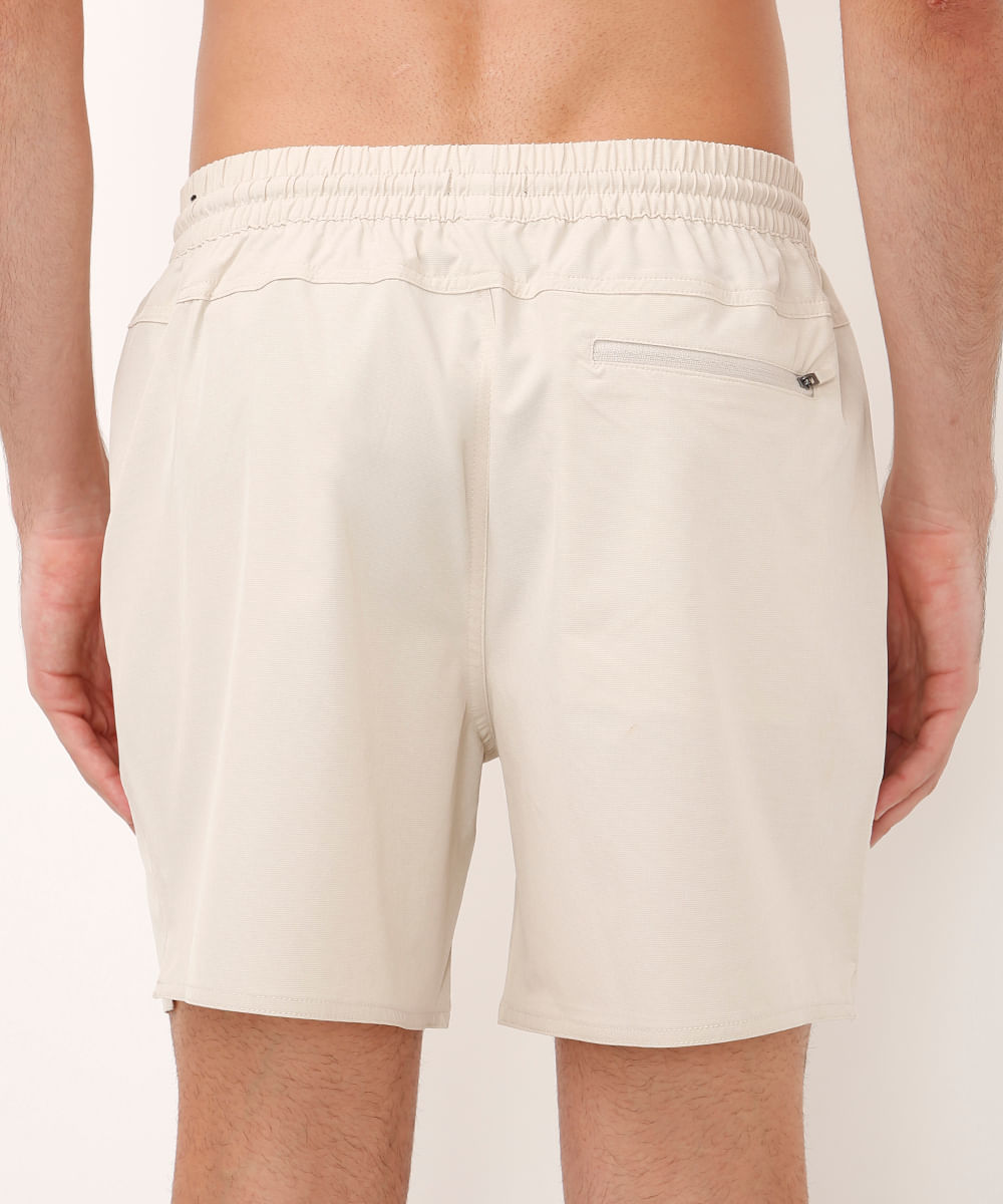 short cós elástico bolso com zíper bege