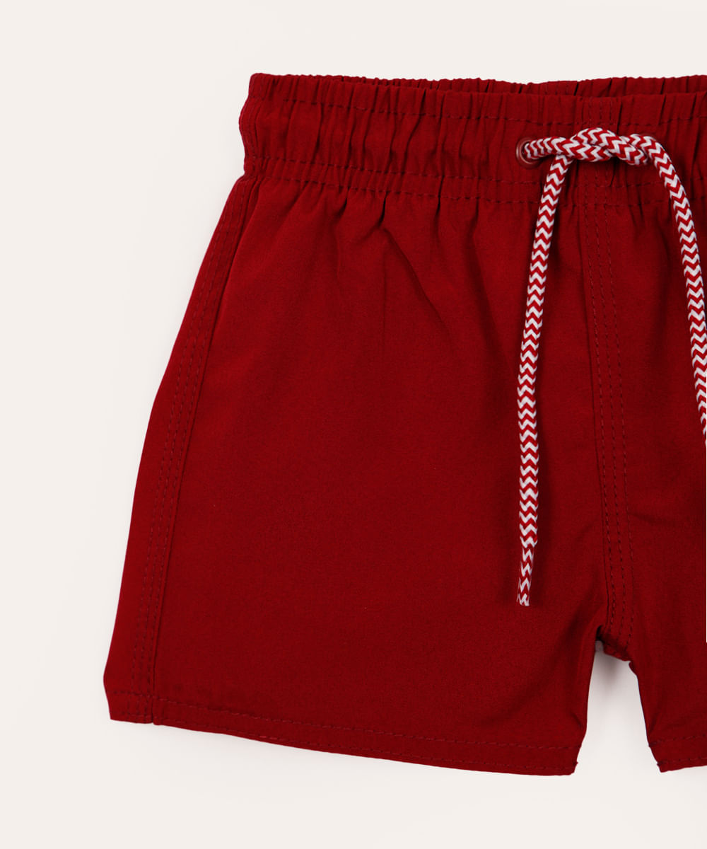 boardshort infantil com bolso vermelho