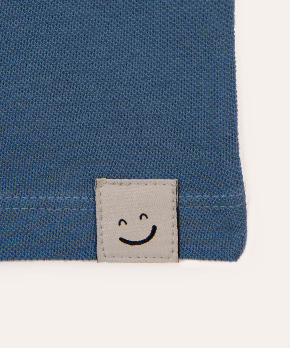 regata de algodão infantil com botão azul