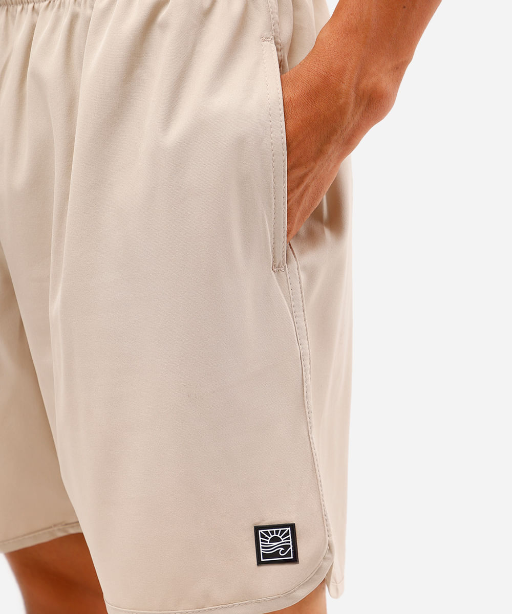 short masculino cós elástico bolso com zíper bege