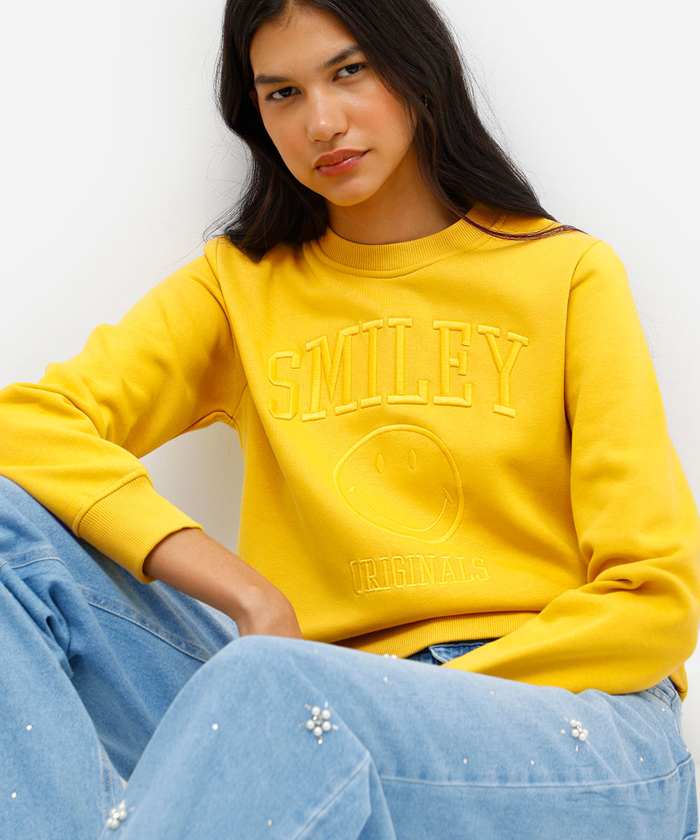 blusão feminino de moletom felpado com bordado smiley amarelo