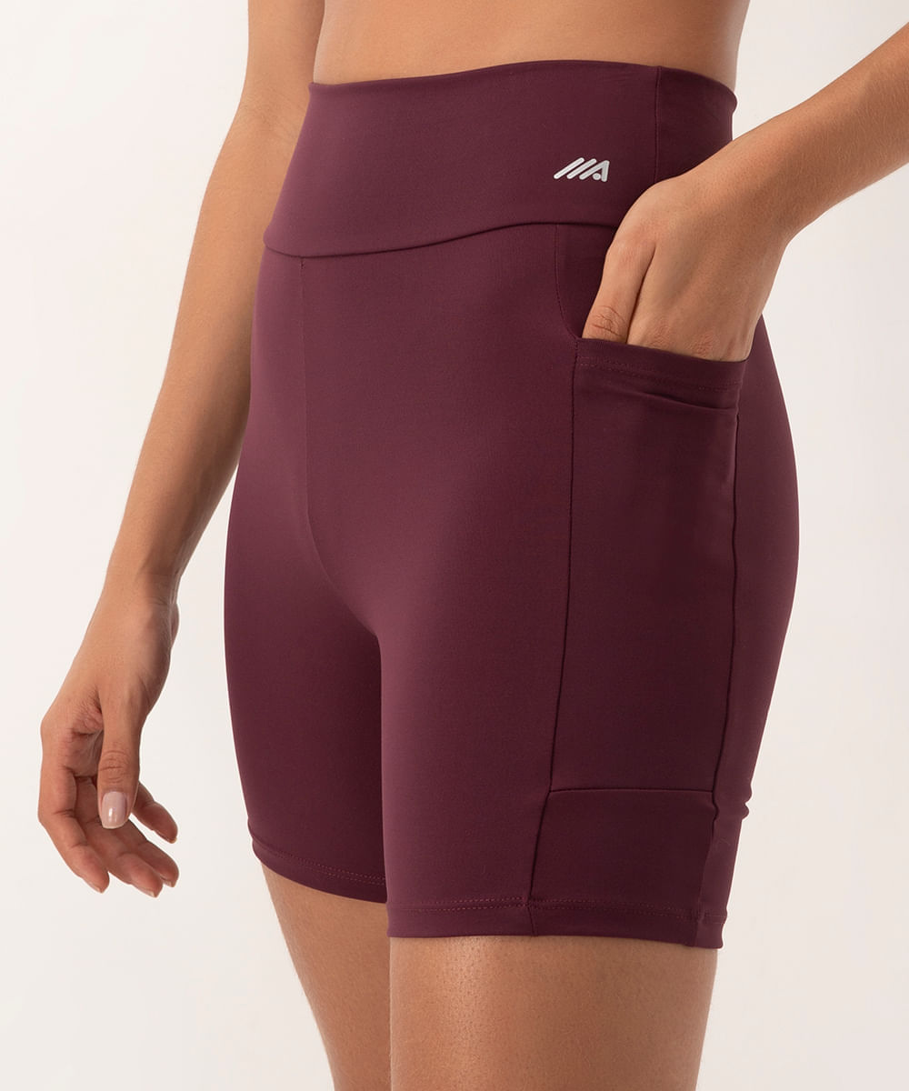 bermuda esportiva cós largo com bolso lateral roxa
