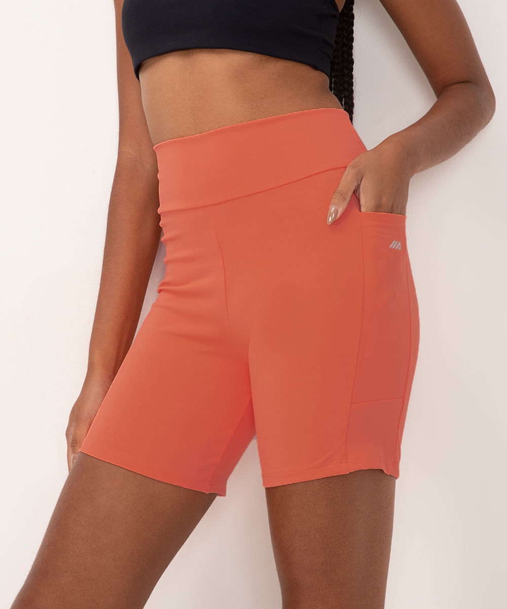 bermuda esportiva cós largo com bolso lateral laranja