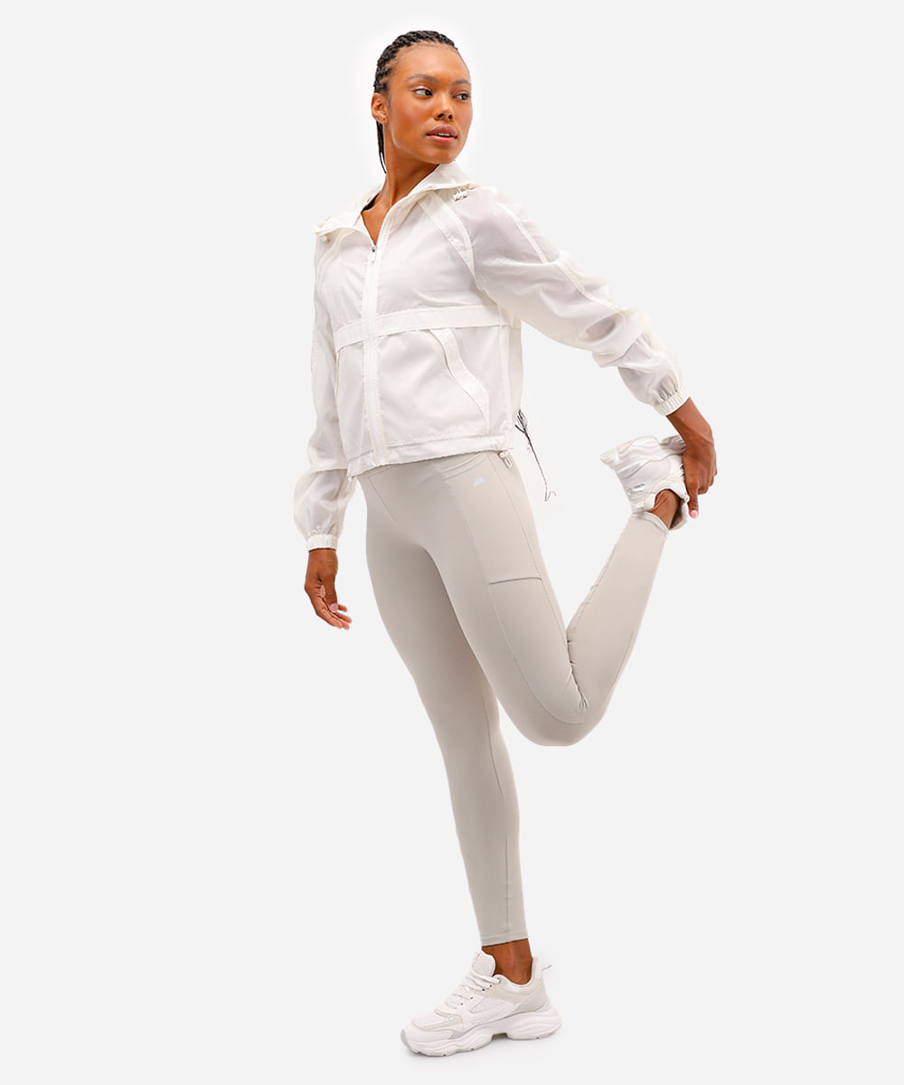 calça legging esportiva com bolso bege