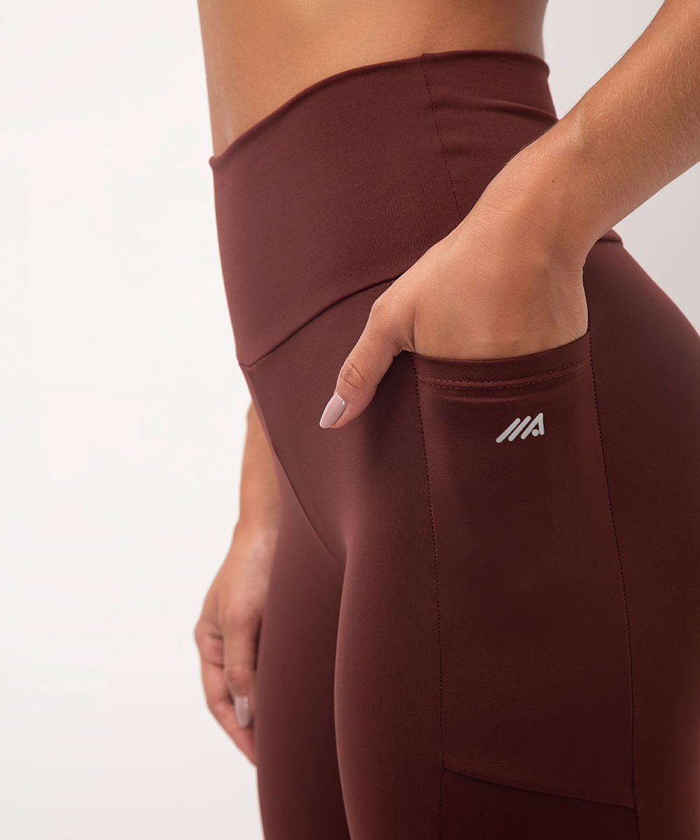 calça legging esportiva com bolso marrom