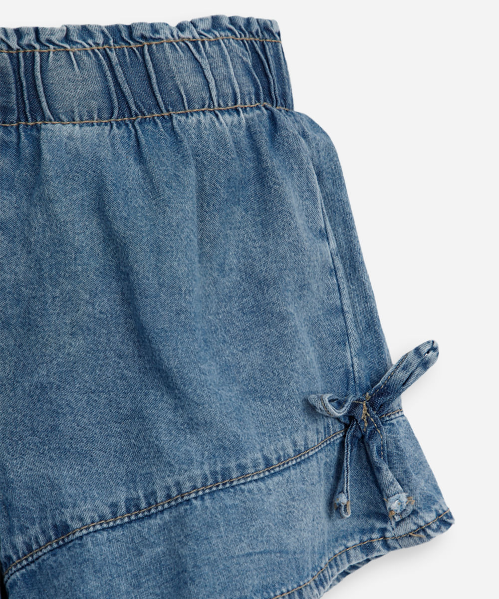 short infantil jeans com recorte e laços azul