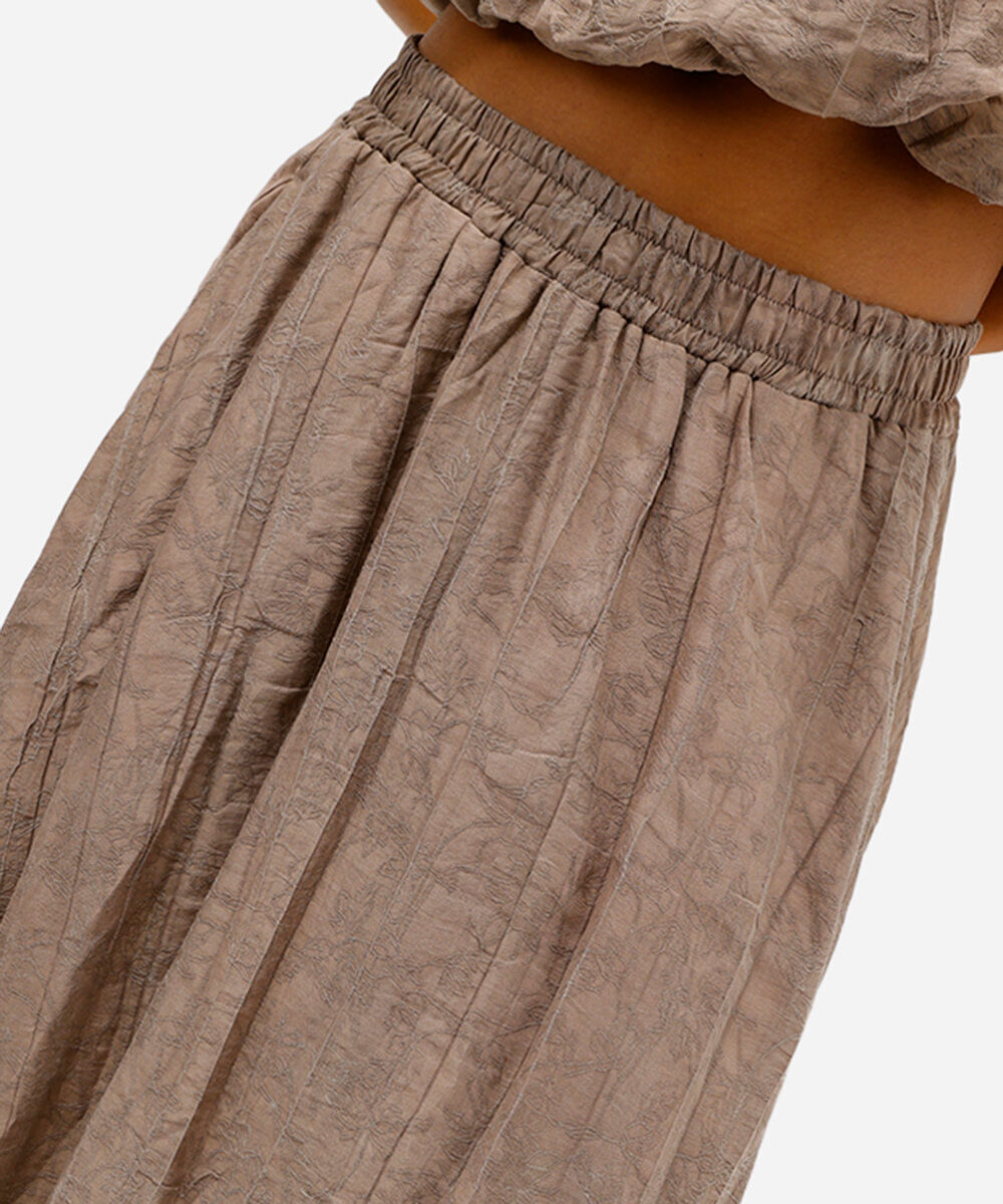 saia plissada feminina em jacquard floral bege