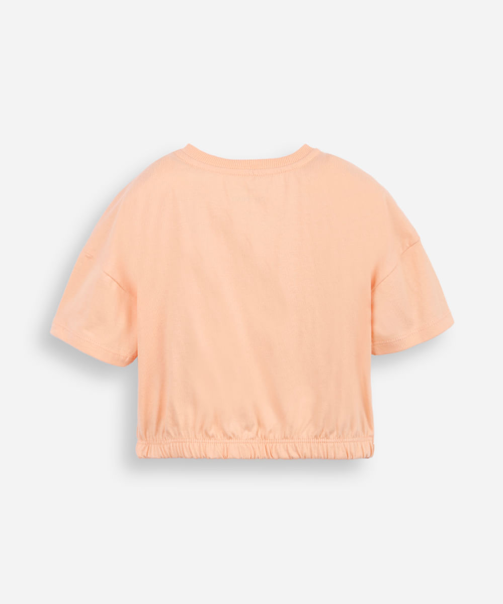 camiseta infantil barra elástico com aplicação de paetê de flor laranja