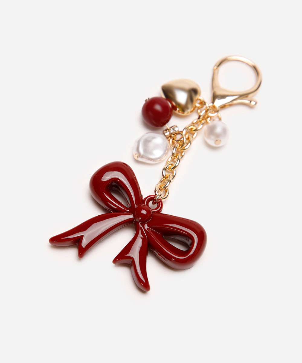 chaveiro bag charm com laço e pérolas vermelho