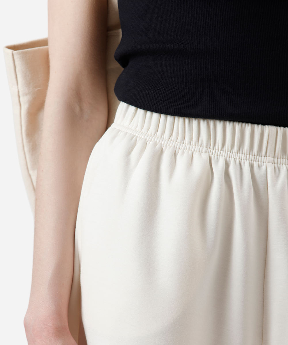 short básico feminino de moletom cós elástico bege