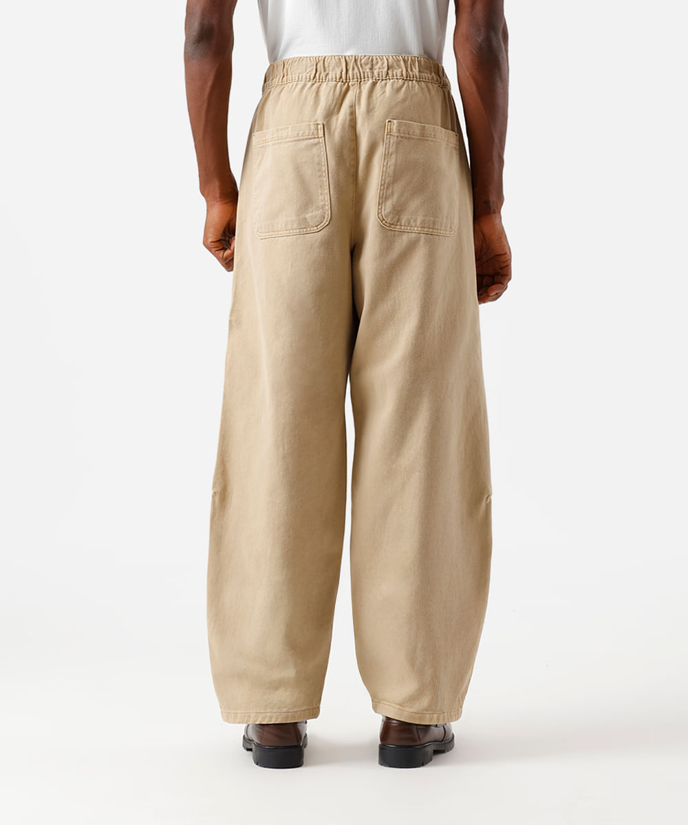 calça super baggy masculina de sarja com recortes cós elástico bege