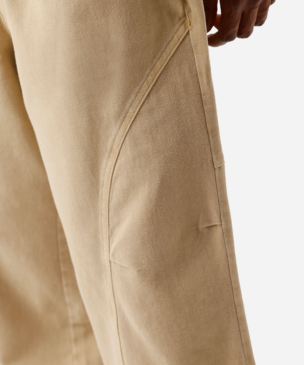 calça super baggy masculina de sarja com recortes cós elástico bege