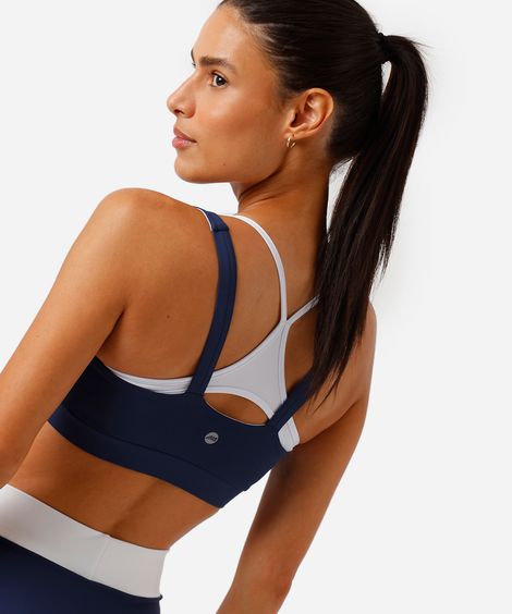 top feminino esportivo com sobreposição bicolor azul