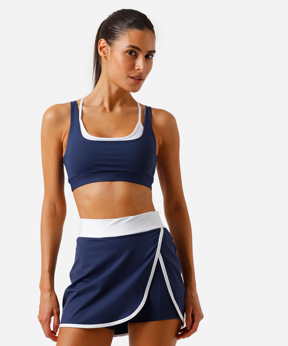 top feminino esportivo com sobreposição bicolor azul