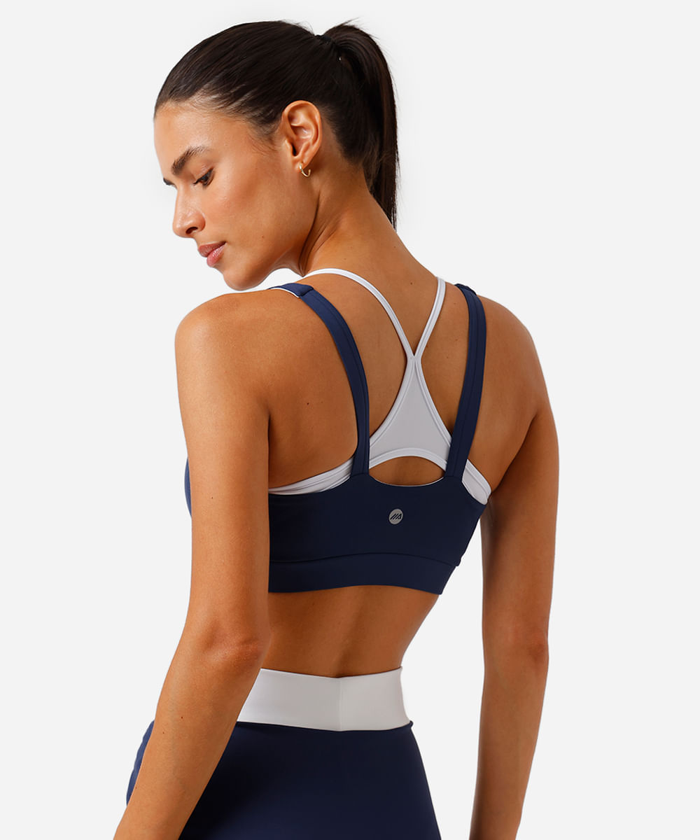 top feminino esportivo com sobreposição bicolor azul