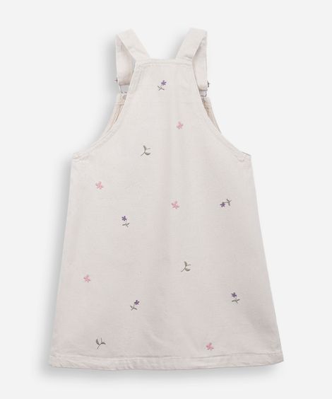 salopete infantil de sarja com bordados floral bege