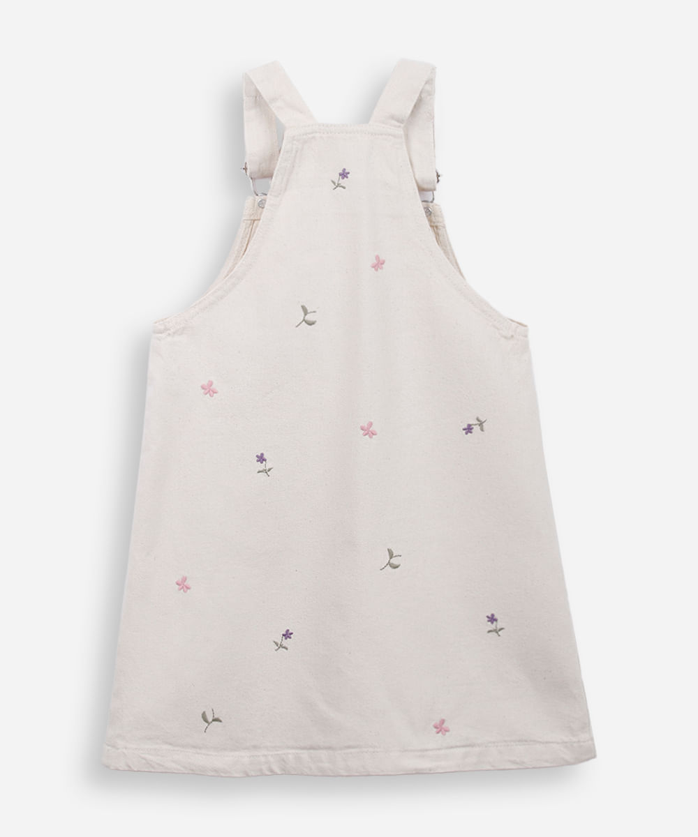 salopete infantil de sarja com bordados floral bege