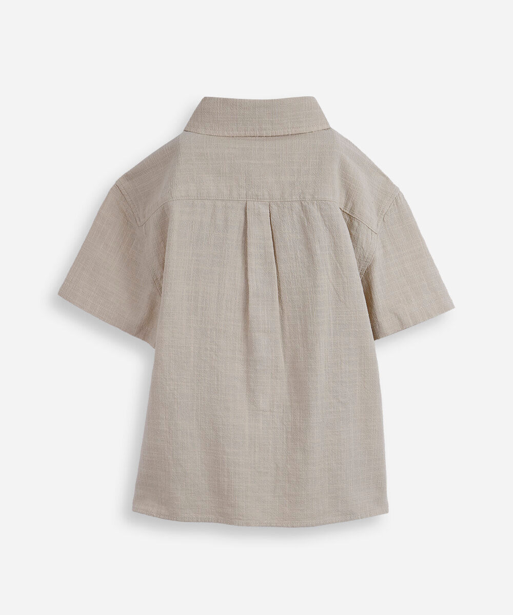 camisa infantil de algodão texturizada com bolso bege