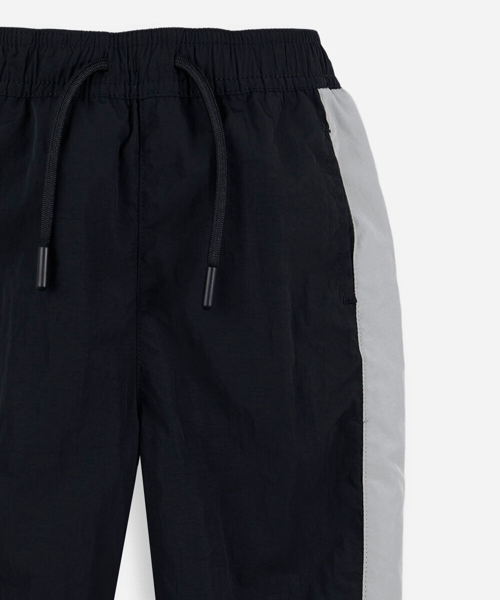 calça jogger esportiva infantil de poliamida com recortes preta