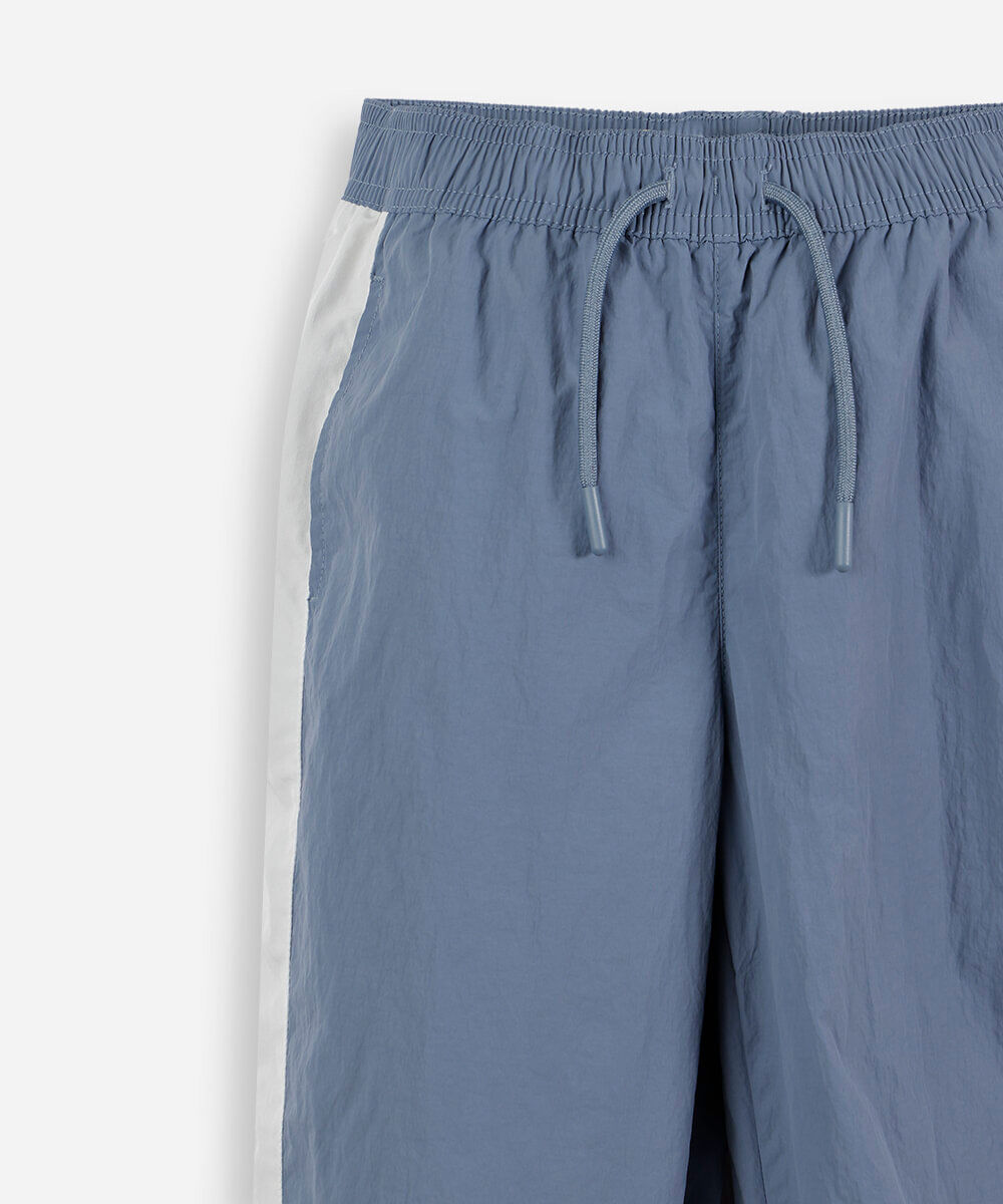 calça jogger esportiva infantil de poliamida com recortes azul