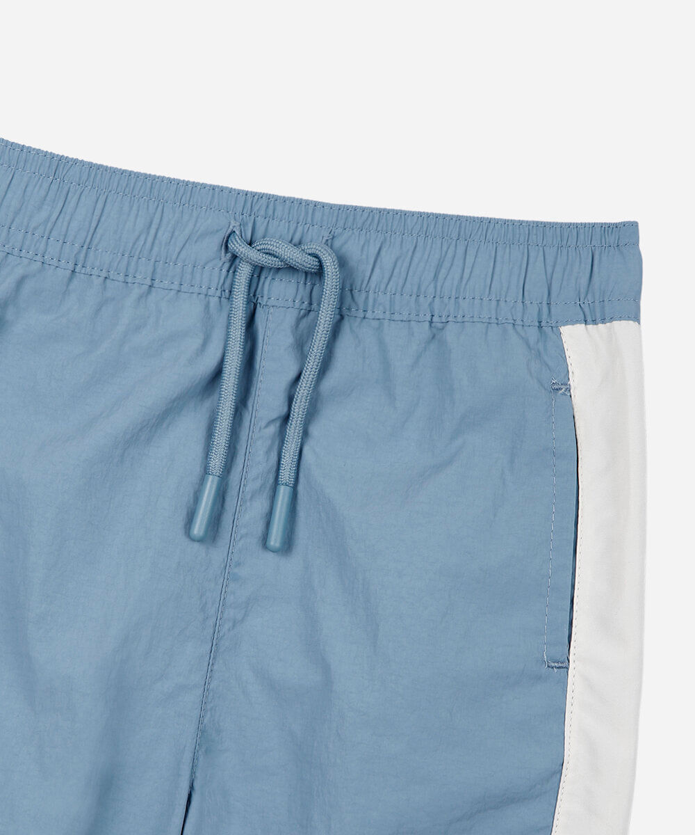 calça jogger esportiva infantil de poliamida com recortes azul