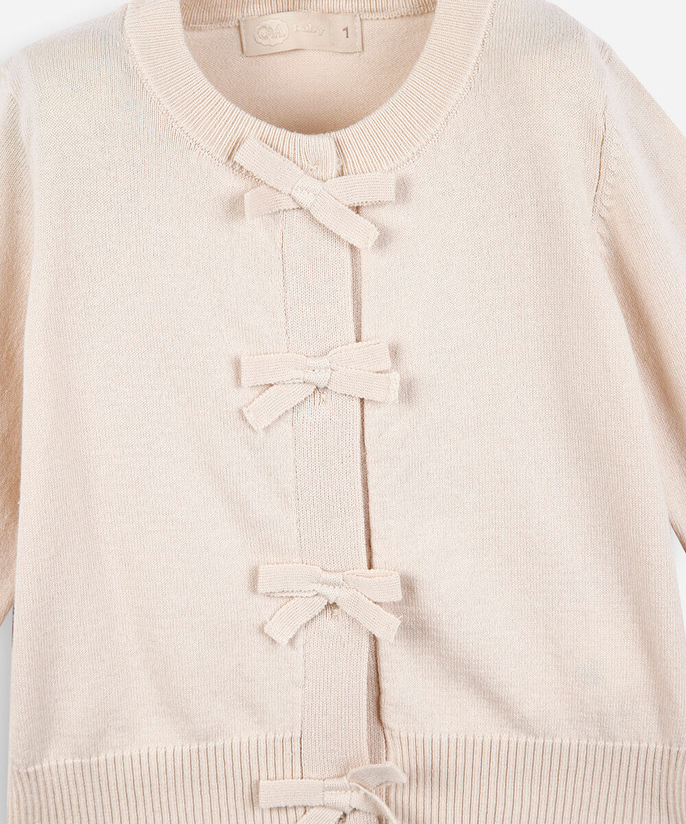 cardigan infantil de tricot com lacinhos bege