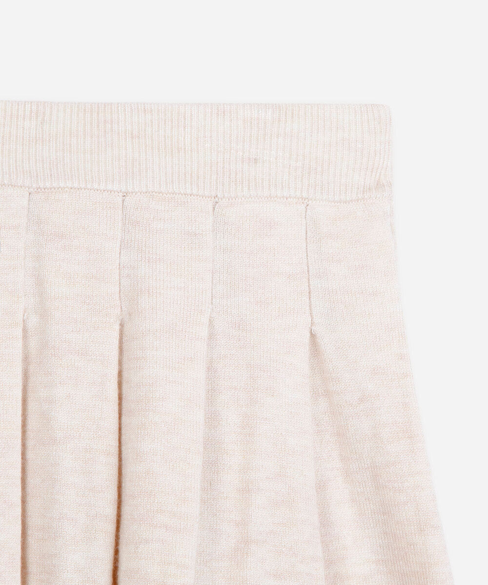 saia infantil em tricot plissada bege