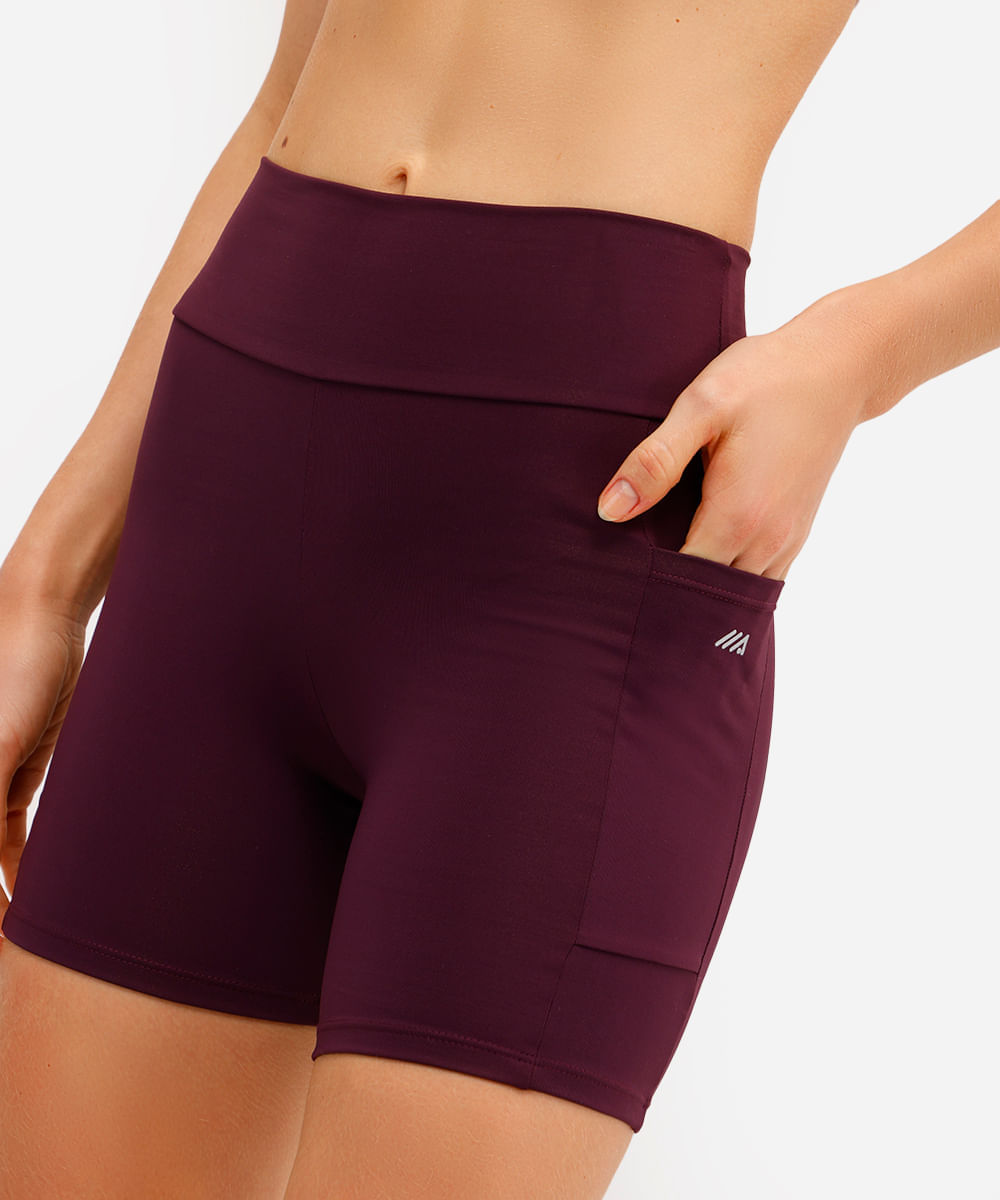 bermuda esportiva cós largo com bolso lateral roxa
