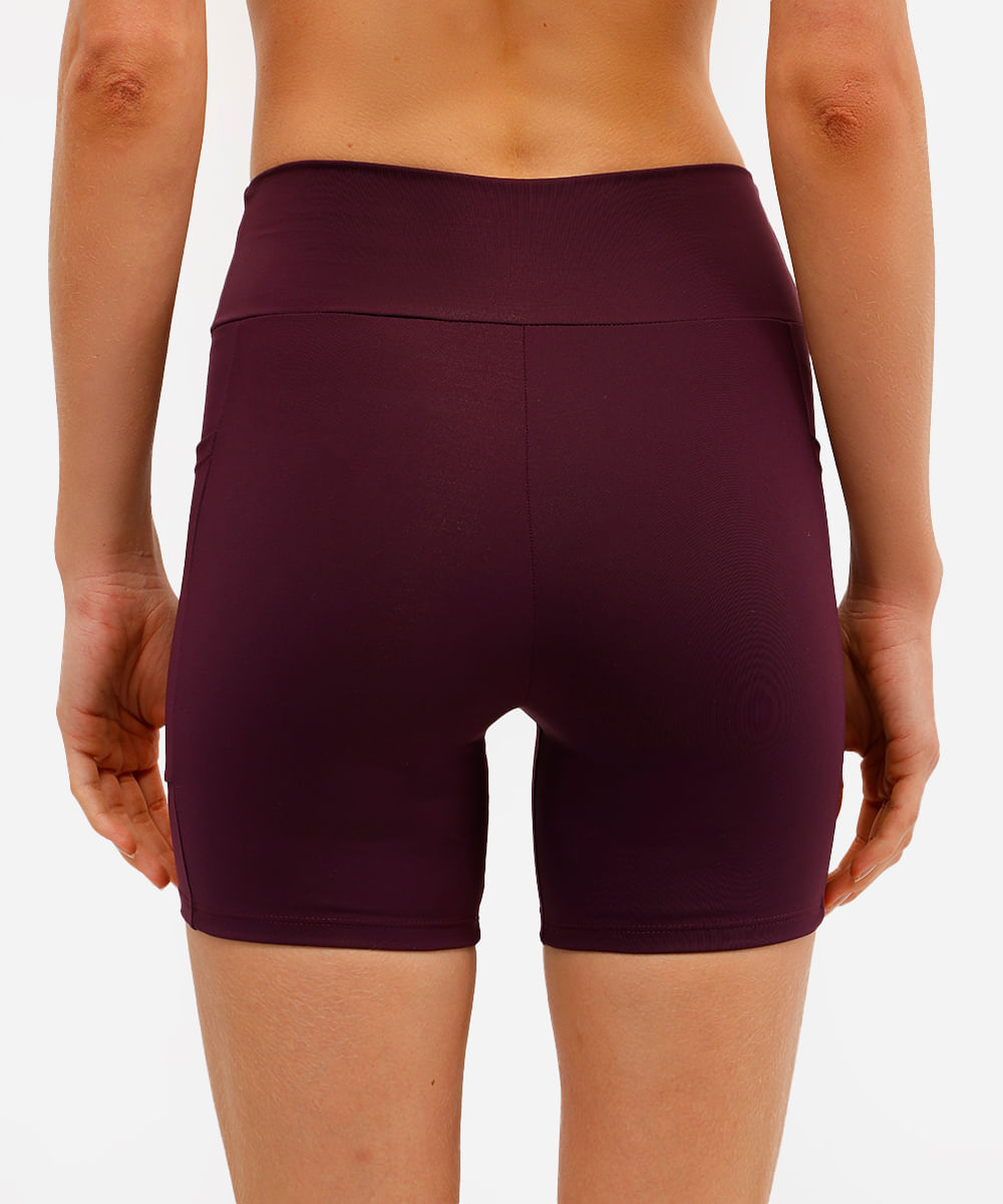 bermuda esportiva cós largo com bolso lateral roxa