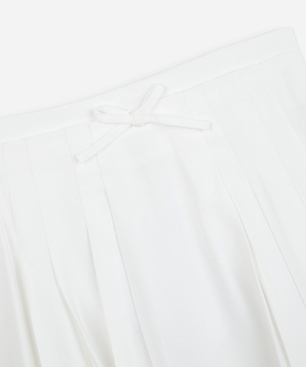 saia infantil plissada de viscose com lacinho off white