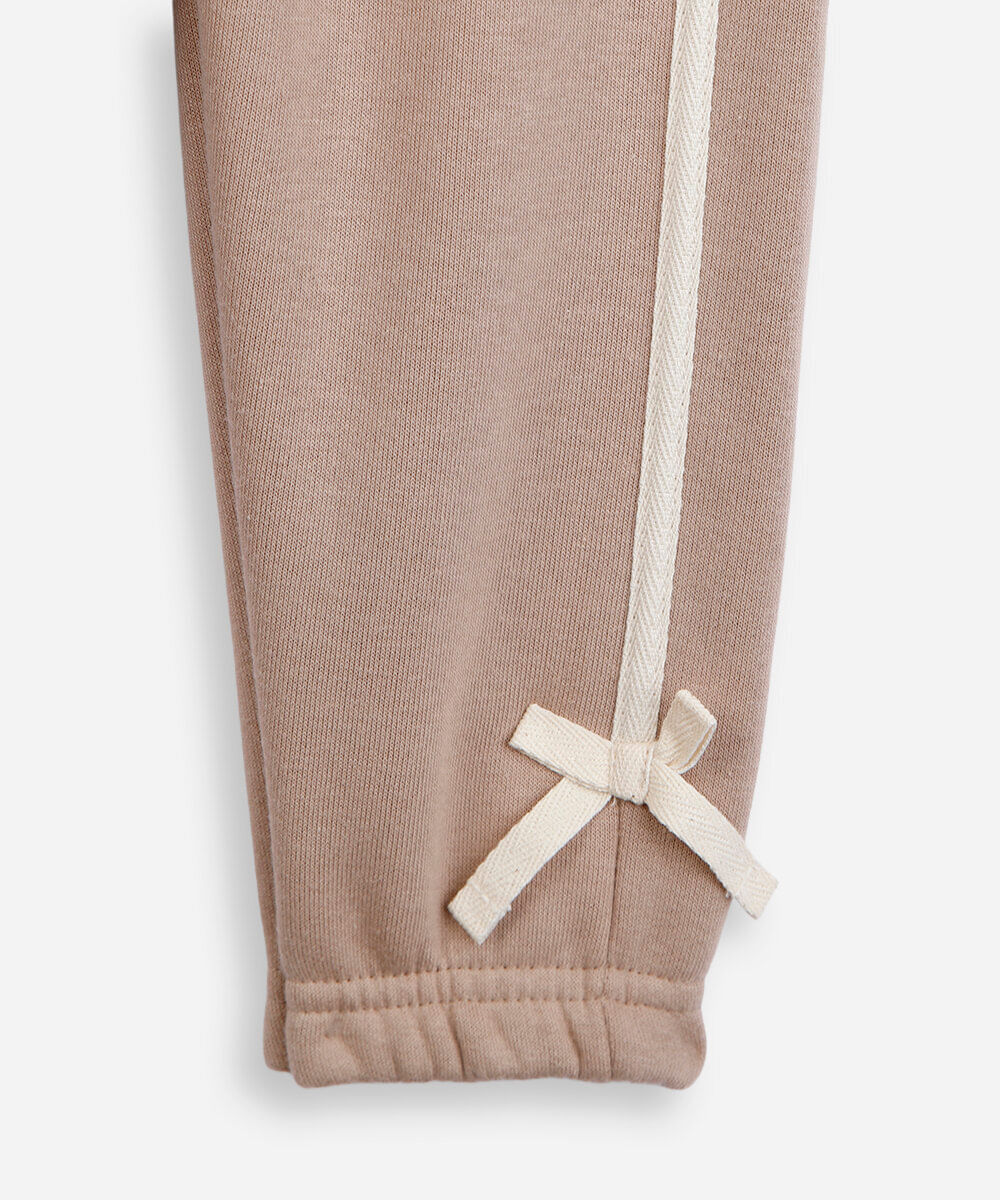 calça jogger infantil de moletom com laços bege