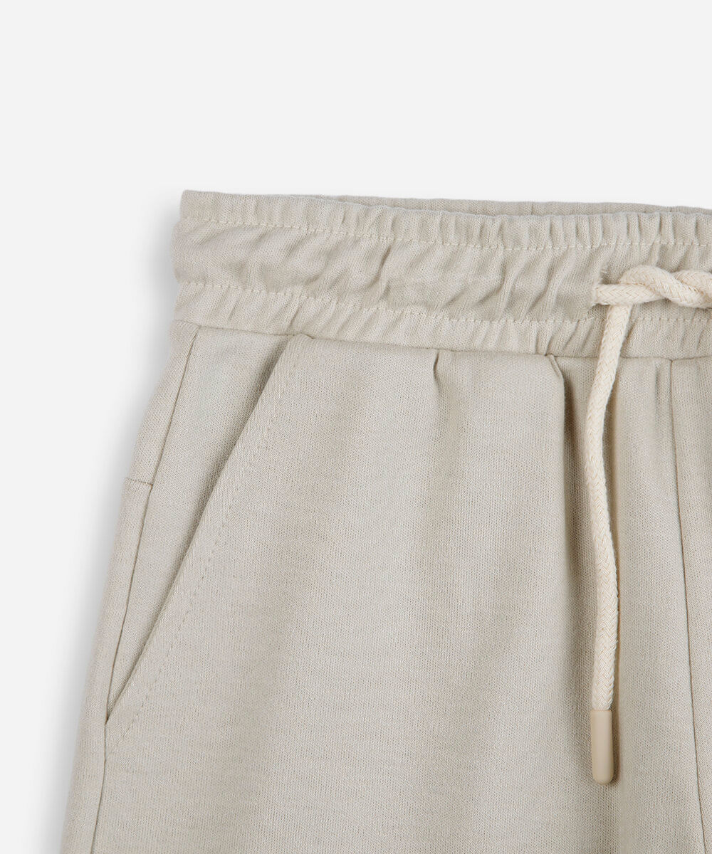 short infantil de moletom bege