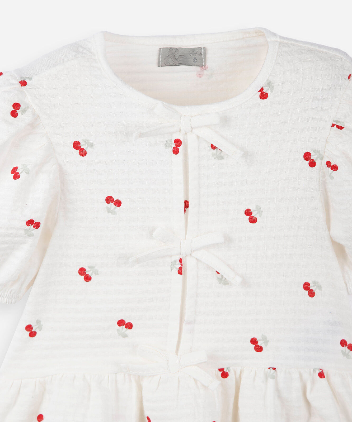 blusa infantil peplum estampada com laços e manga bufante branco
